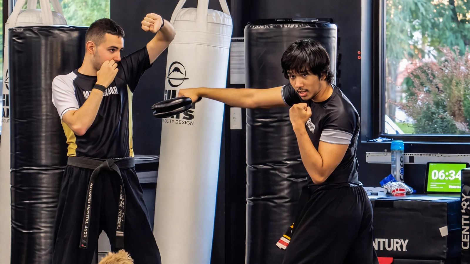 A Warrior child driving a punch into the bag: energy with a job to do