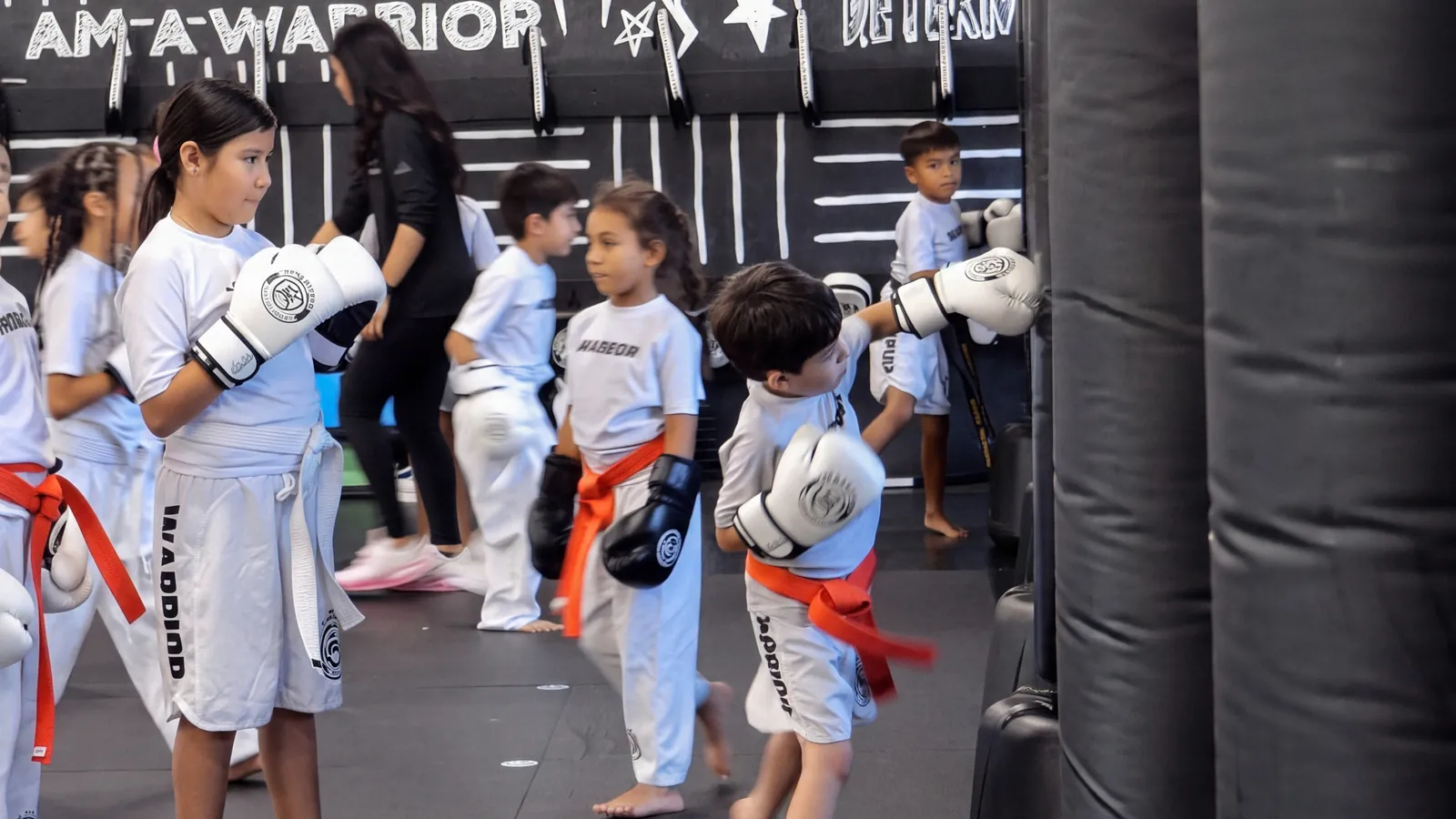A Warrior class lined up in stance, ready to train
